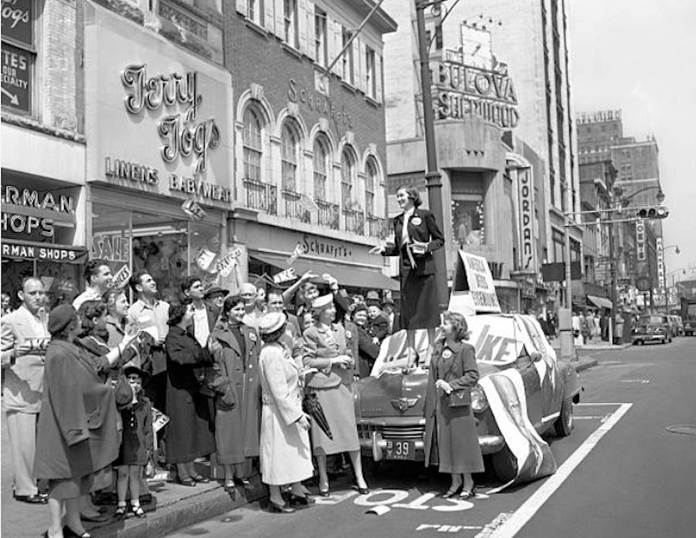 I Like Ike
Dorothy Dimm, an Eisenhower for President worker, distributes pamphlets and buttons from atop a campaign car on Broad Street in Newark. Ike forces were out in full strength for last-day campaigning for votes in the New Jersey primary, Apil 15th.

Photo from Bettmann
