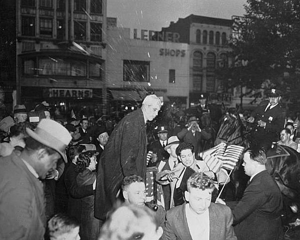 Norman Thomas Target for Barrage of Eggs
Rotten eggs and ripe tomatoes break against the face and body of Norman Thomas, Socialist leader, as a crowd of hostile demonstrators go into action to break up a Socialist meeting he attempted to address in Military Park, in the center of the city. The demonstrators, many of them wearing veteran's caps and carrying banners such as 'Reds Keep Out,' marched into the park with a band, which drowned out Thomas as he attempted to speak. Police, who had granted the permit for the meeting, were unable to preserve order and finally escorted Thomas, covered with red and yellow blobs, from the park. Thomas claimed that the pelting was carried out 'by a band of unruly men, obviously taking orders from Jersey City.'
