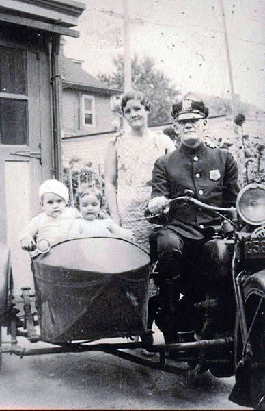 Tighe, John C.
Newark Police Dept 1924 to 1945.  That is his wife, my Aunt Bea, and their two sons, Jack and Dick, in the backyard of their home here in Newark at 833 Degraw Ave, up here in the North Ward.  Judging from the age of the boys I'd say that the photo was taken sometime  around 1935.  Uncle John was one of the first Newark Police officers with the Motor Cycle Squad; one of the first with the old Emergency Squad, and was the Treasurer of the Newark PBA when he died in 1945.
Photo from Jule Spohn
